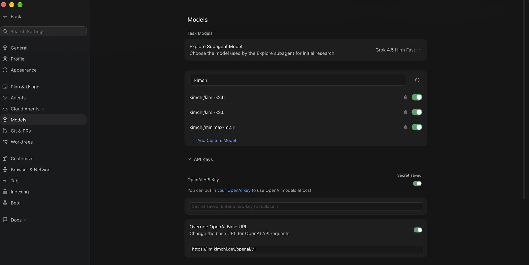 Cursor's Models settings with Kimchi models enabled and the OpenAI base URL pointed at llm.kimchi.dev